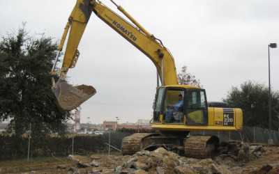 Komatsu PC220 Excavator Removing Concrete from Parking Lot